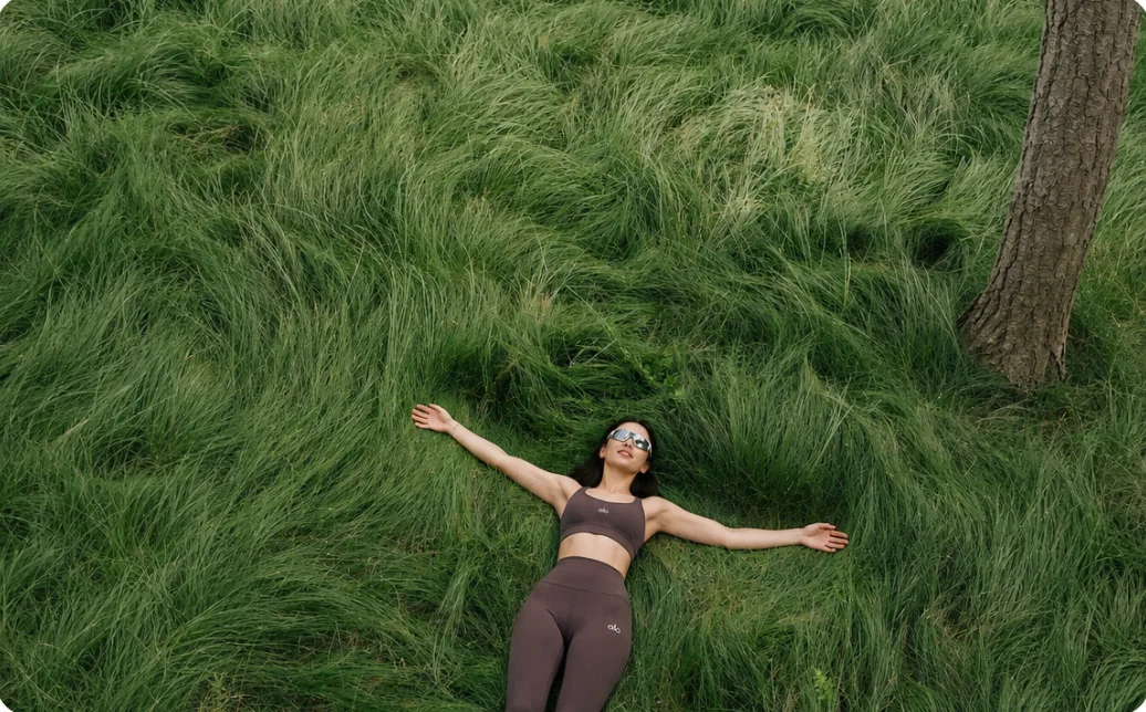 Woman lying in tall grass
